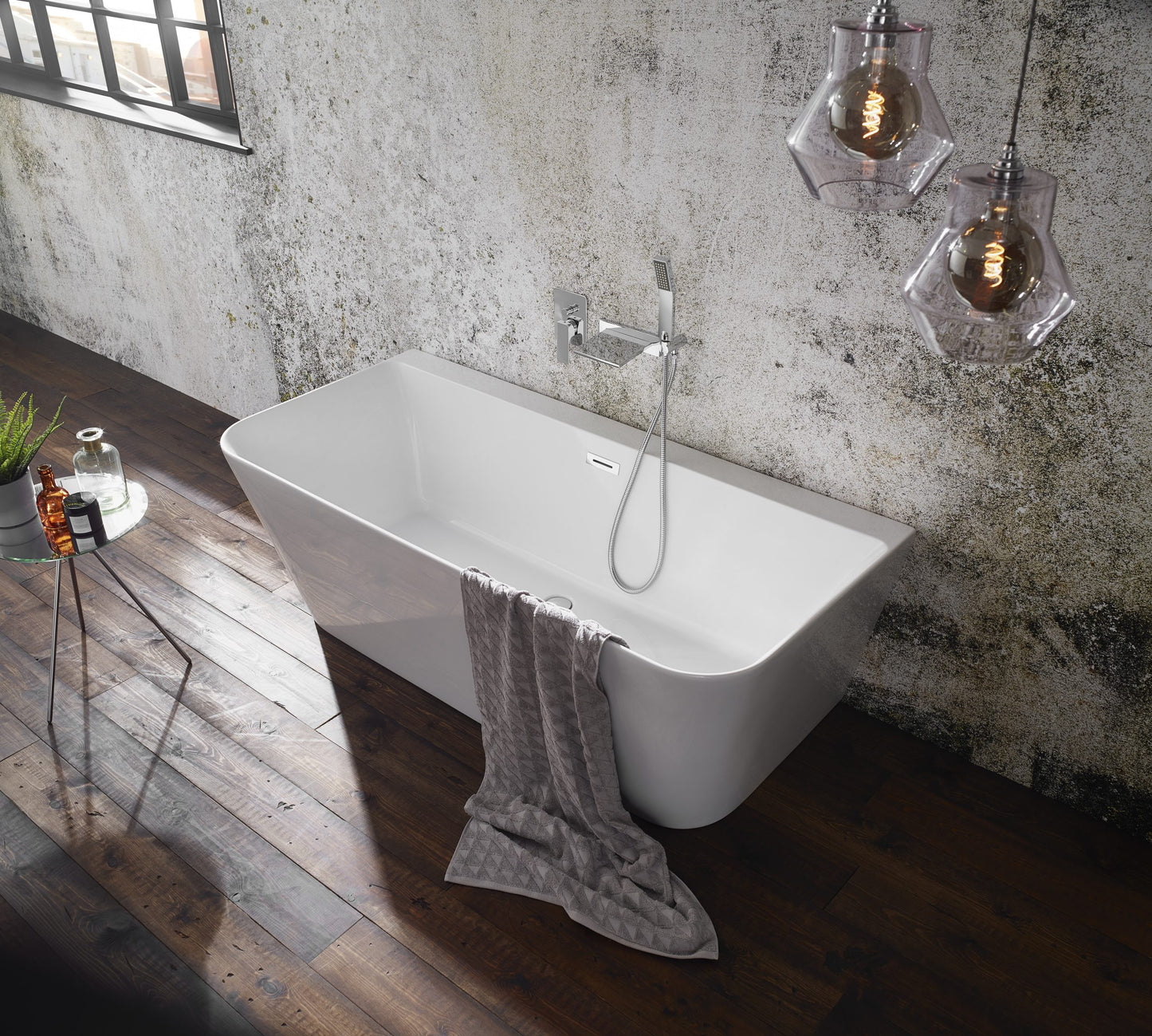 Frontline Aquakast Mono freestanding back-to-wall bathtub in white with smooth curves, measuring 1700 x 800mm.
