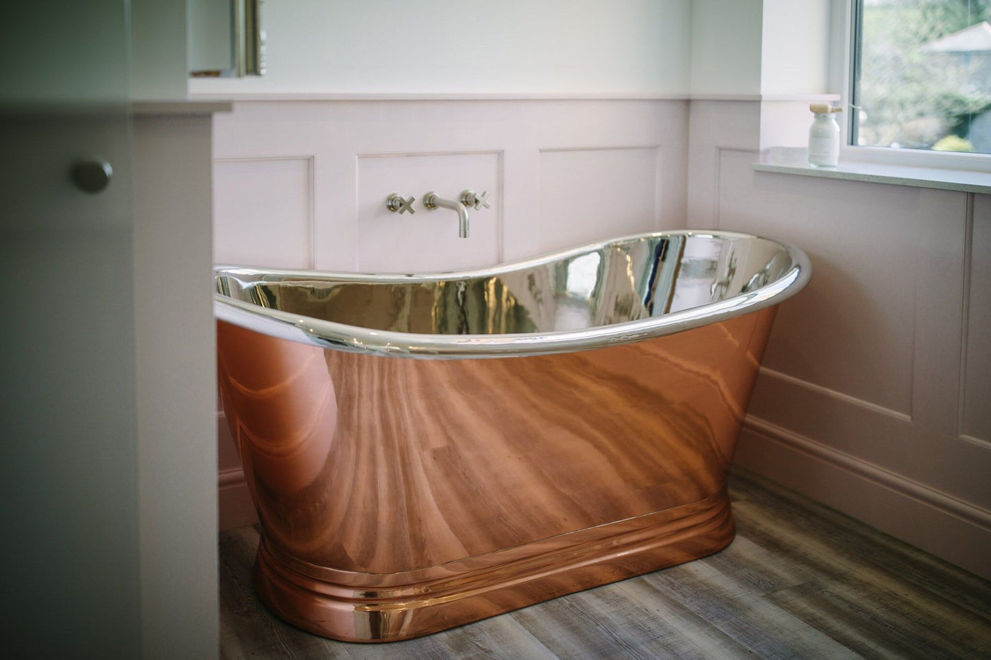 BC Designs Copper Nickel 1700mm freestanding boat-shaped bathtub with elegant curved design and polished finish.