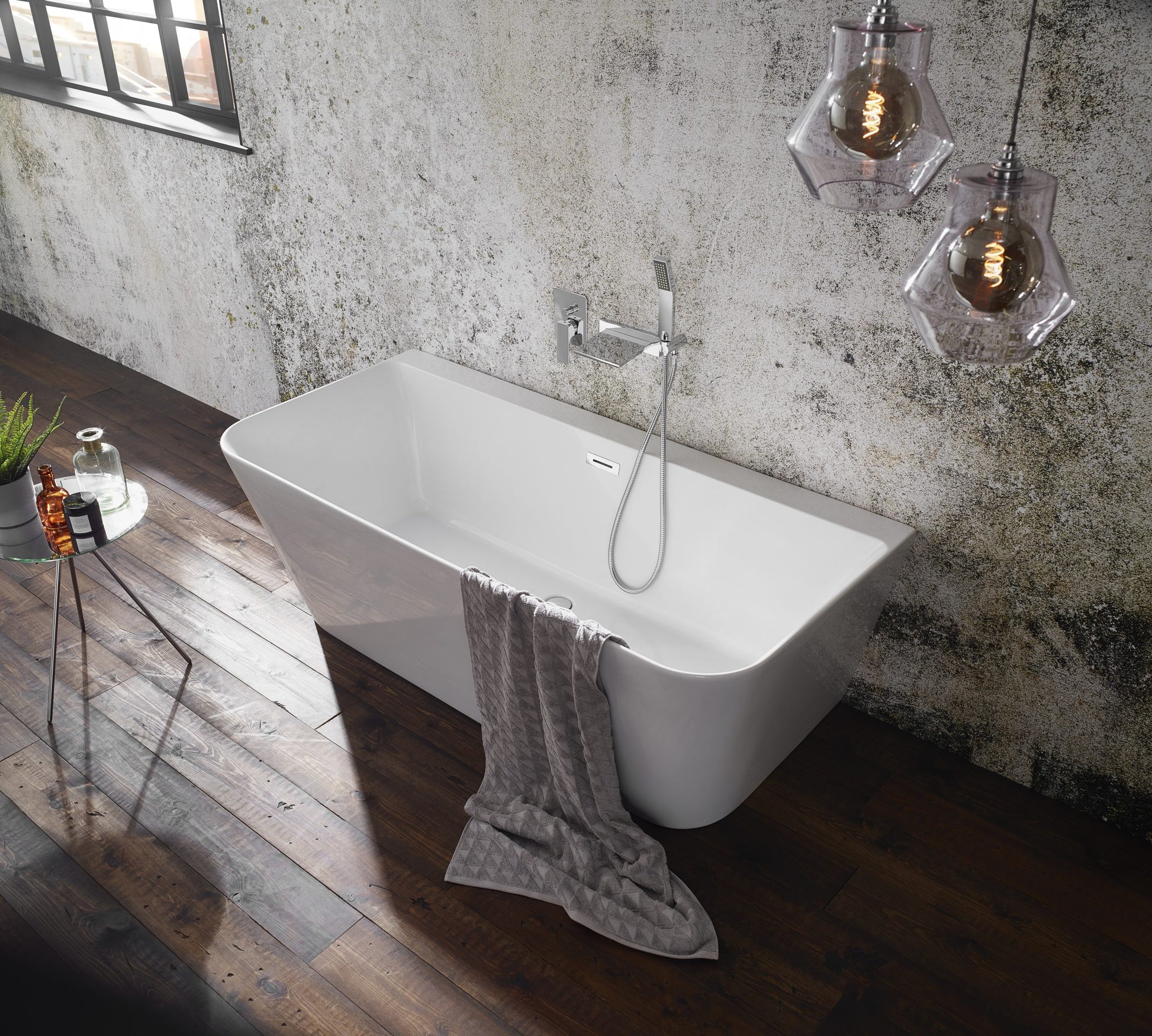 Frontline Aquakast Mono freestanding back-to-wall bathtub in white with smooth curves, measuring 1700 x 800mm.